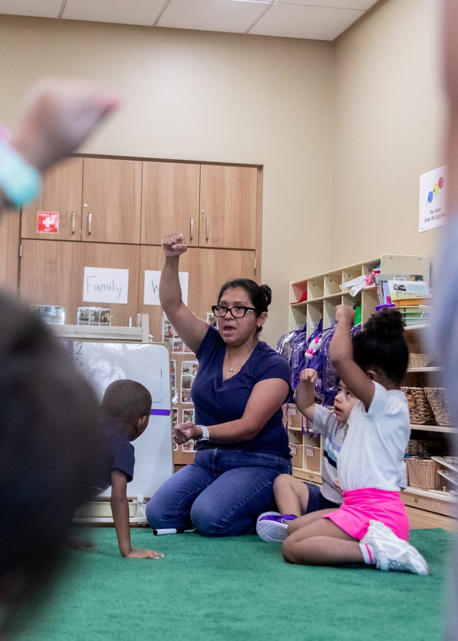 A Pre-K 4 SA teacher leading a classroom activity with children